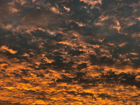 Red sunset sky with clouds at eveningの写真素材