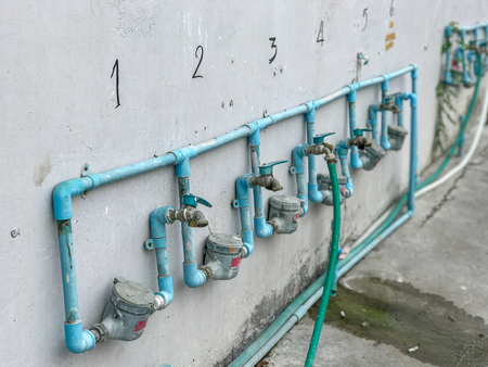Row of faucet for washing dish at canteenの写真素材