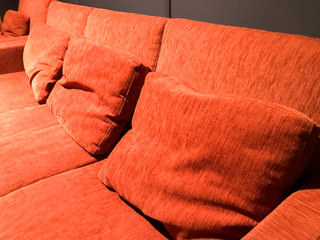 Orange sofa and black wall in living roomの写真素材