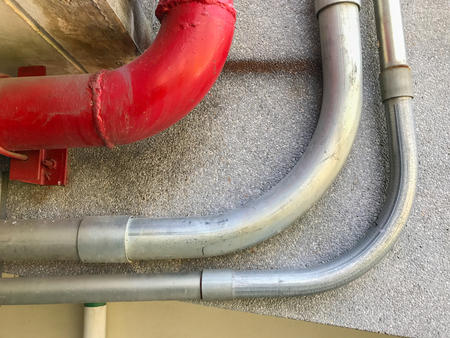 colorful of pipe under the modern buildingの写真素材