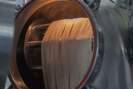 close up of textile factory steam machine at factoryの写真素材