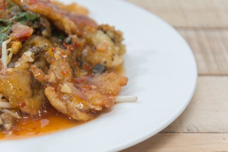 oysters fried in egg batter (Hoi Tod) on plateの写真素材