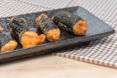 close up of seaweed chicken roll on plateの写真素材