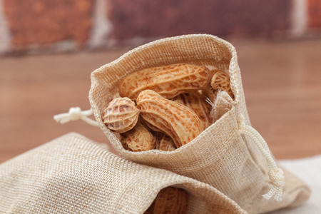 close up of boiled peanuts on sack burlap