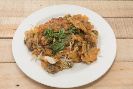 oysters fried in egg batter (Hoi Tod) on plateの写真素材
