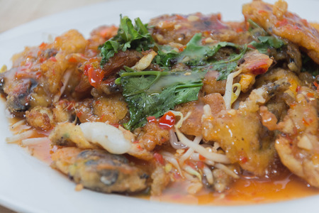 oysters fried in egg batter (Hoi Tod) on plateの写真素材