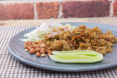 Crispy catfish salad with green mango in thailandの写真素材