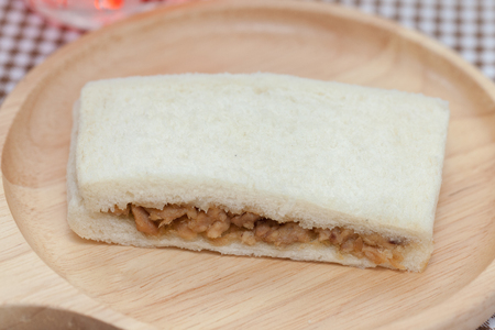 close up of tuna sandwich on wooden plateの写真素材
