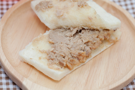 Close up of tuna sandwich on wooden plateの写真素材