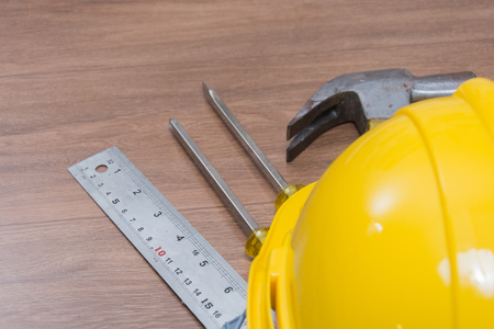 top view of yellow safety helmet and some toolsの写真素材