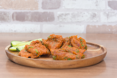 Fried Fish paste balls on wooden plateの写真素材
