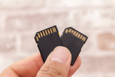 hand holding old memory card, Concept of data storageの写真素材