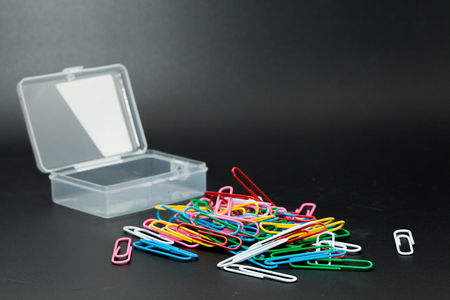 paper clip and box on black backgroundの写真素材