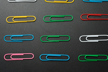 row of paper clip on black background, different conceptの写真素材