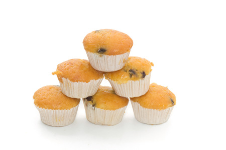Banana Cup Cakes with raisin topping isolated on white backgroundの写真素材