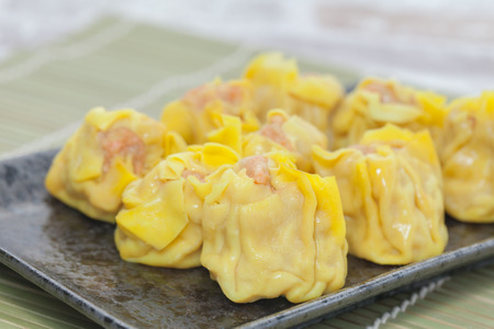 close up of shrimp wonton on black plateの写真素材