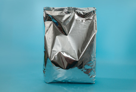 close up of snack foil bag on blue backgroundの写真素材