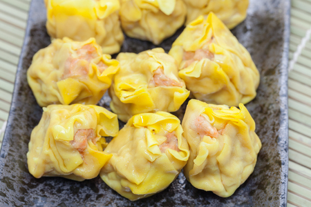 close up of shrimp wonton on black plateの写真素材