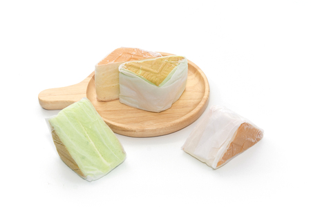 orange and pandan  Chiffon cake on wooden plateの写真素材