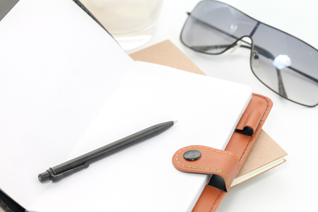 coconut juice and notebook on white backgroundの写真素材