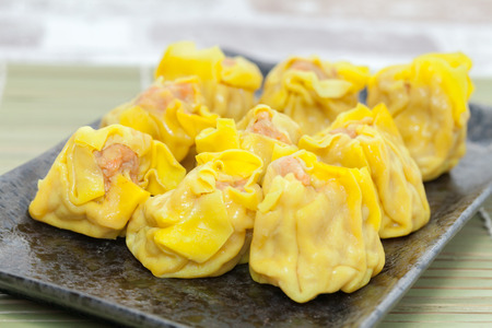 close up of shrimp wonton on black plateの写真素材