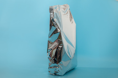 close up of snack foil bag on blue backgroundの写真素材