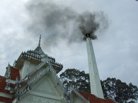 thai crematory with smoke on sad dayの写真素材