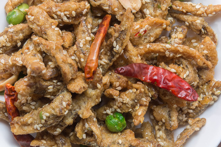 close up of fried crispy tiny fish on plateの写真素材