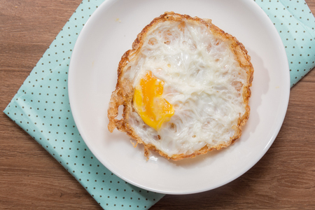 close up of fried egg on plateの写真素材