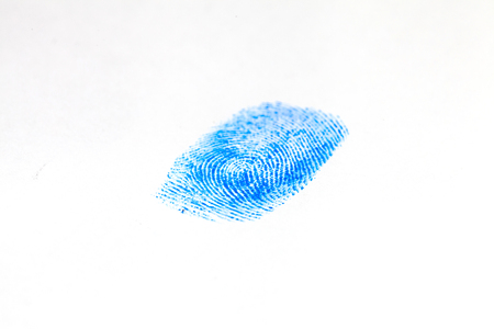 hand in blue glove and blue fingerprintの写真素材