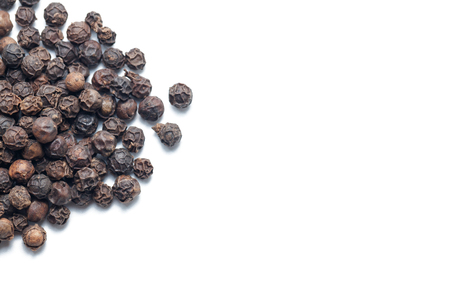 Pile of black pepper isolated on white background の写真素材