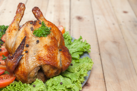 close up of grilled chicken on wooden tableの写真素材
