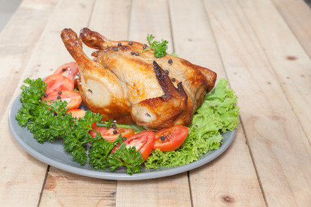 close up of grilled chicken on wooden tableの写真素材
