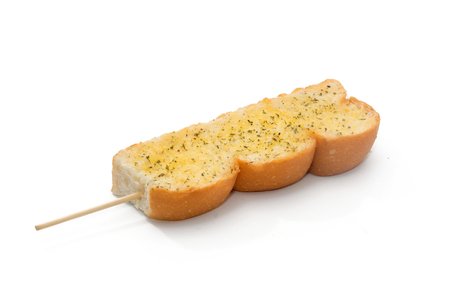 garlic and herb bread isolated on white backgroundの写真素材