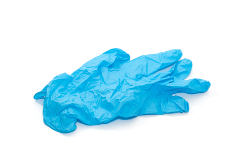 blue thin medical glove isolated on white backgroundの写真素材