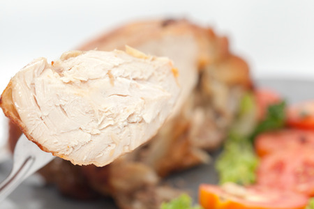close up of roast chicken on plateの写真素材