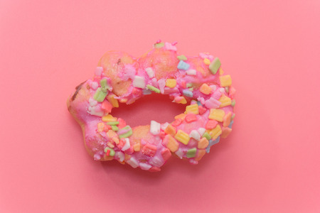 close up of colorful doughnut on pink backgroundの写真素材