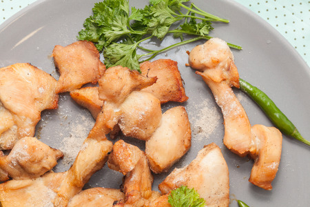 close up of grilled chicken breast on plateの写真素材