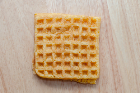 close up of waffle with corn on wooden plateの写真素材