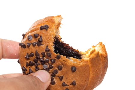 hand holding Chocolate Chips Coffee Bunの写真素材