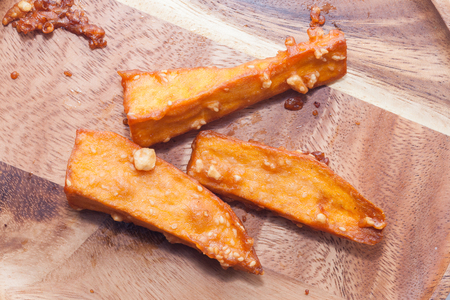 deep fried sliced sweet potato on white backgroundの写真素材