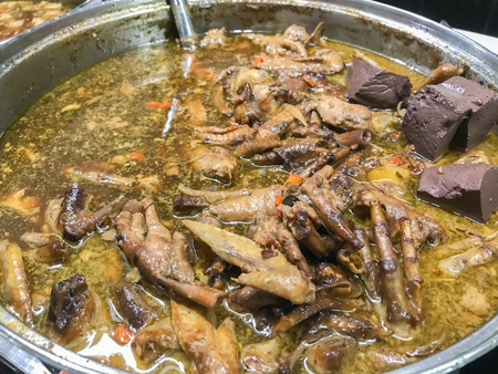 stewed pork noodle soup in big potの写真素材
