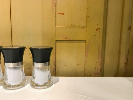 row of salt glass jar on the tableの写真素材