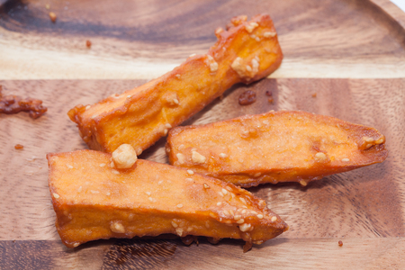 deep fried sliced sweet potato on white backgroundの写真素材
