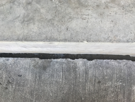 crack of the concrete building base at thailandの写真素材