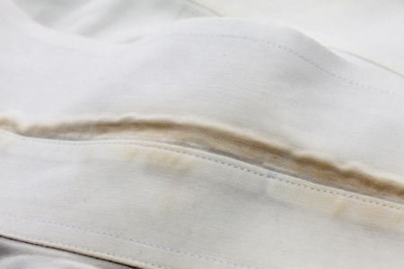 close up stain of the dirty white shirtの写真素材