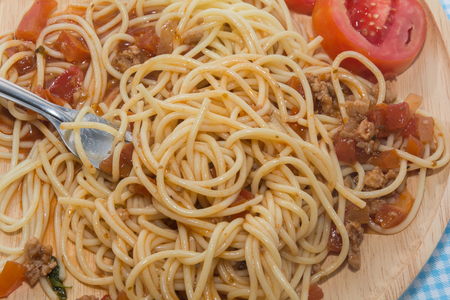 close up of spaghetti with sauce and forkの写真素材