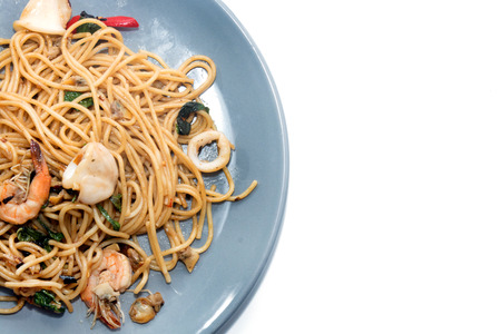 spaghetti with seafood on plate isolated on white backgroundの写真素材