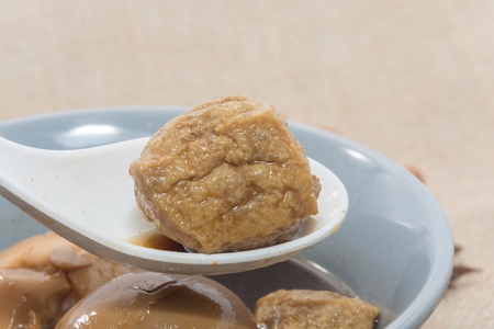 Eggs boiled stewed in the gravy on white backgroundの写真素材