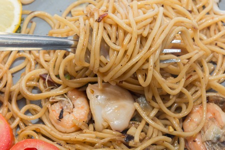 close up of spaghetti seafood with forkの写真素材